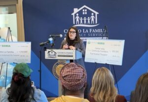 woman speaks at podium