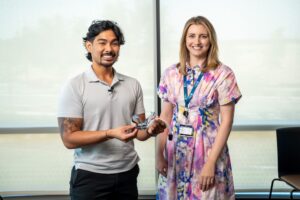 two people posing with a medical device