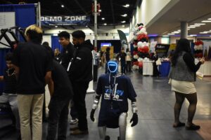 humanoid robot walking a convention floor